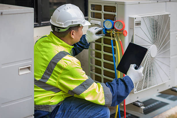 Professional Hvac Maintenance technician working in Urbana, IL